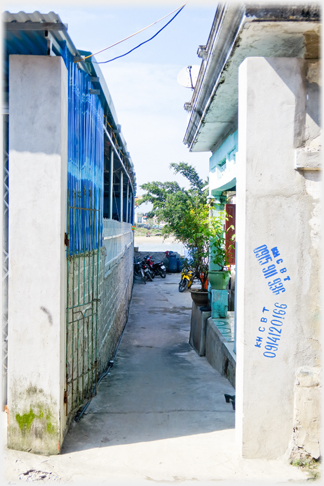 Side passage from main street with river just visible at the end.