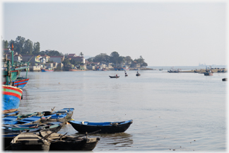 Bay with town on left and sea just visible on horizon.