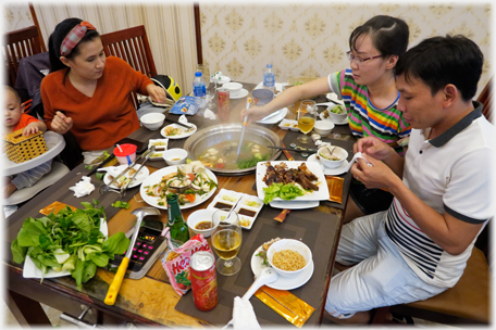 Family cooking in the hot pot.