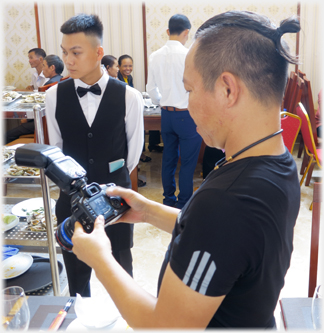 Photographer, dragon and waiter.