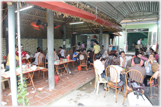 The area beside the covered cafe, now with a metal roof and tables below.