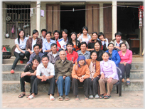 An extended family sitting for a photograph.