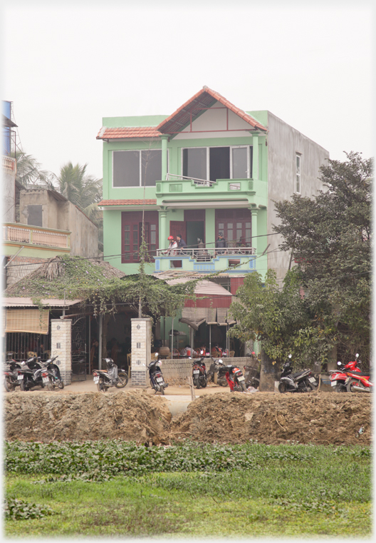 The front of the house with the additional two floors.