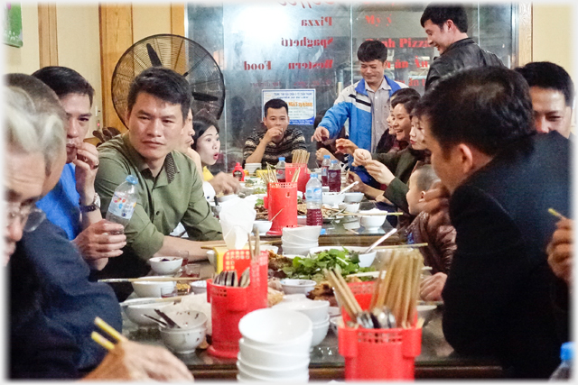 Family and friends eating together.