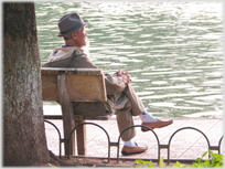 Man sitting by the Lake.