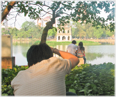 Couple being photographed sitting