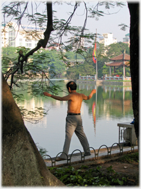 Man stretching with Ngoc Son as background.