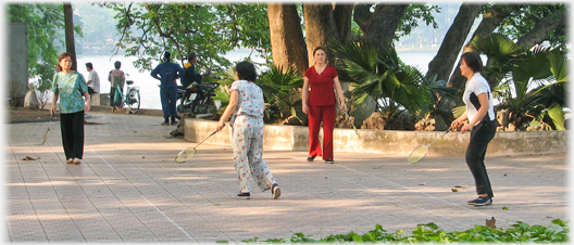 Women playing badminton.