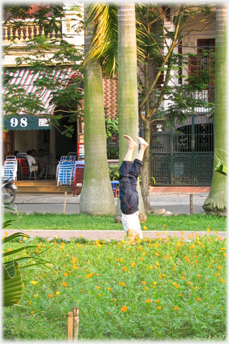 Man walking on his hands.