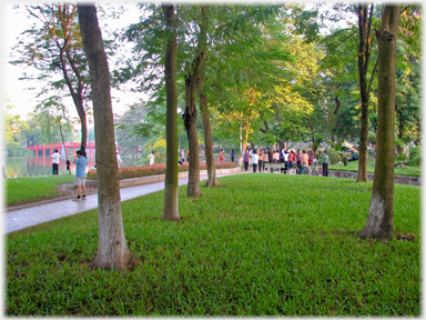 Groups and individuals exercising with the The Huc Bridge beyond.