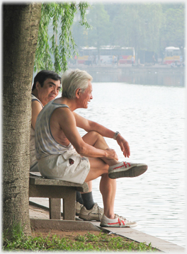 Two men talking by the Lake