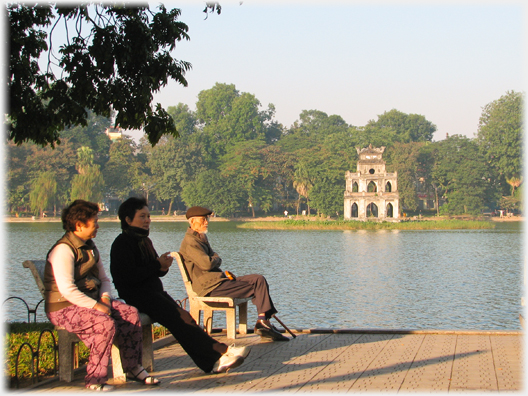 Three people sitting.