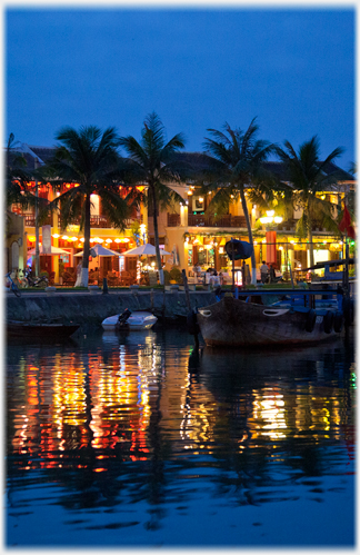 Cafes by the river at dusk.