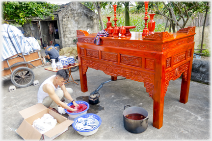 Han preparing to wash the new altar.