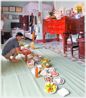 Mats laid out with dishes food down the middle.