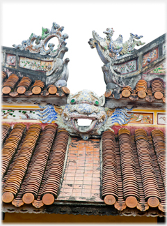 Face on roof decoration.