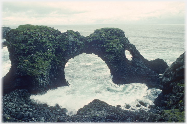 Sea stack in shape of an arch.