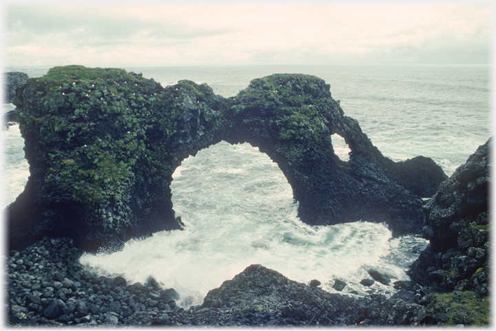 Sea stack in shape of an arch.
