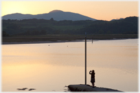 Photographer catching the sunset at Kippford.