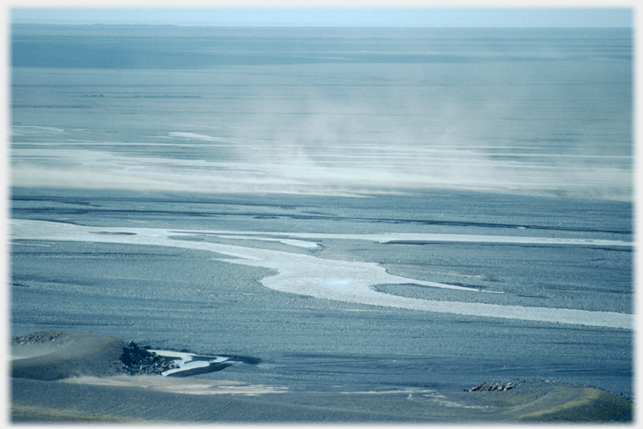 Dust raised by vehicle on coastal ash-fields.