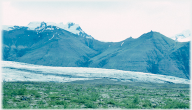 Meadows, glacier and hills.