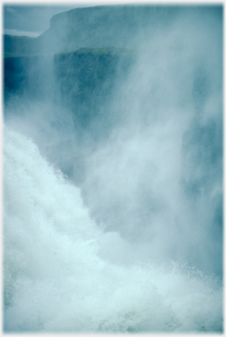 Cliffs seen through the spray.