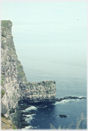 Rock wall projecting out from the cliffs.