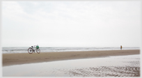 A bike parked on the beach near Tinh Gia.