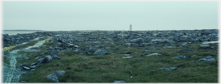 Distant lighthouse at the northern tip of Iceland.