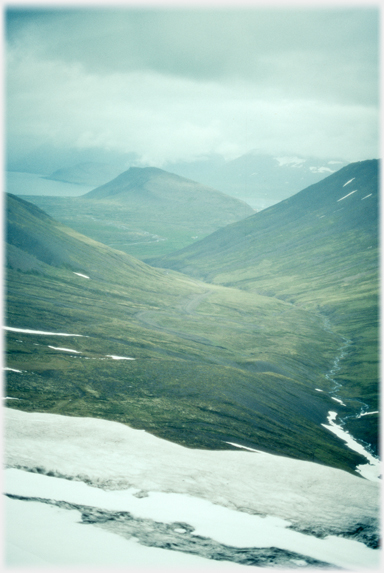 Valley running down from the snow to the fjord.
