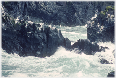 Waves breaking on the rocks.