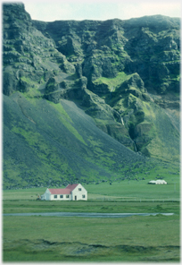 House under cliffs.