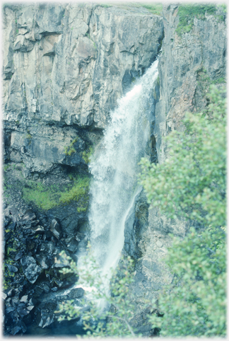 Water spouting from cliffs.