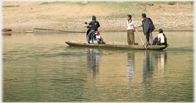 Small ferry with motorbike.