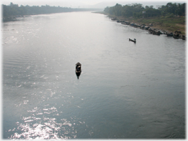 Small boat on a big river.
