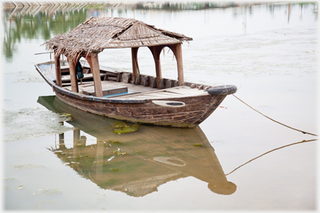 Covered boat.