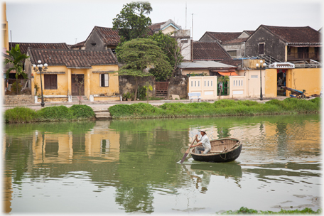 Man rowing coracle.