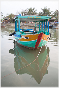 Painted pleasure boat with eye.