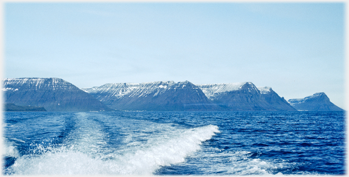 Line of mountains at the fjord's mouth.