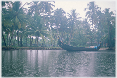 Long boat moored at bank.