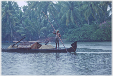 Longboat with cabin anad sand.