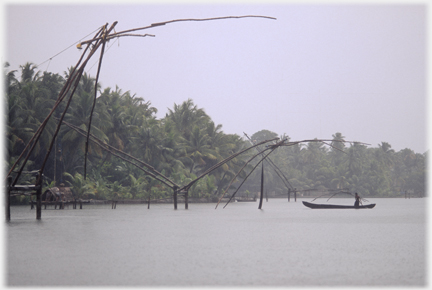 Two frames arching over a canoe.