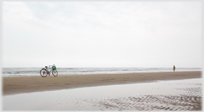 Bike parked on beach.