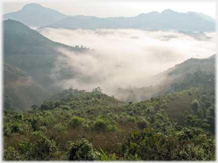 Valley with mist stretching out to distant hills.