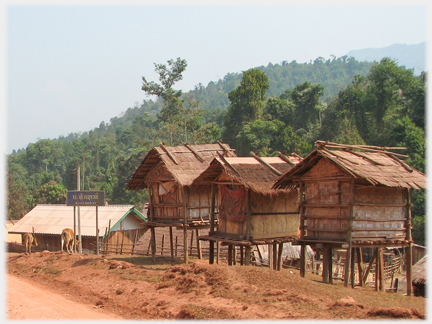 Three small stilted buildings.