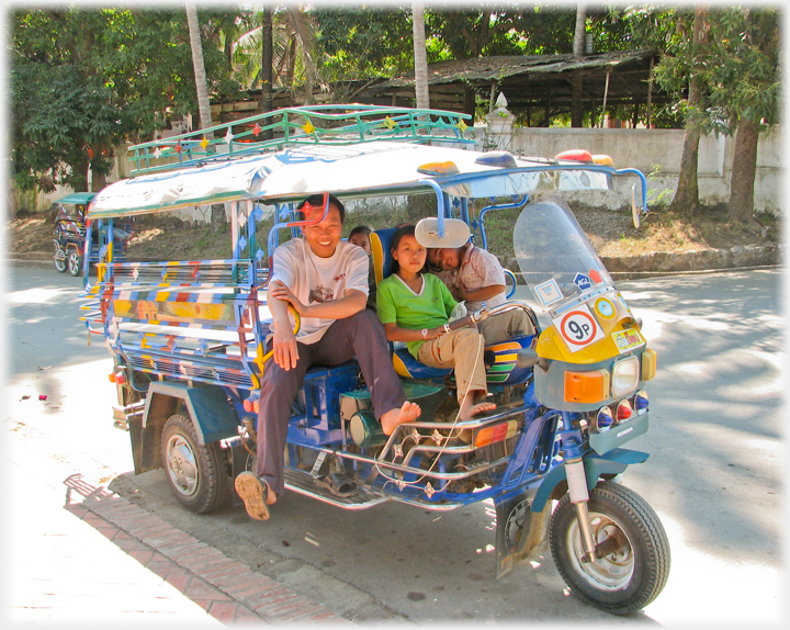 Eight passenger motorbike with family.