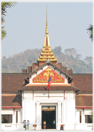The royal palace main entrance with roof and pinnacle behind.