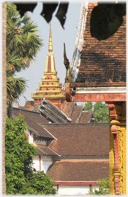 Series of rooftops crowned by the pinnacle.