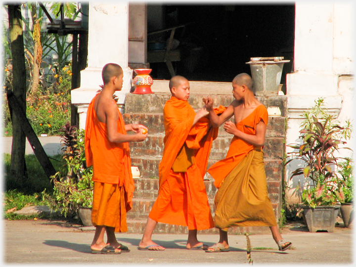 The two monks engage physically.