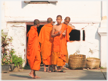 One of the group turns and looks at the camera.